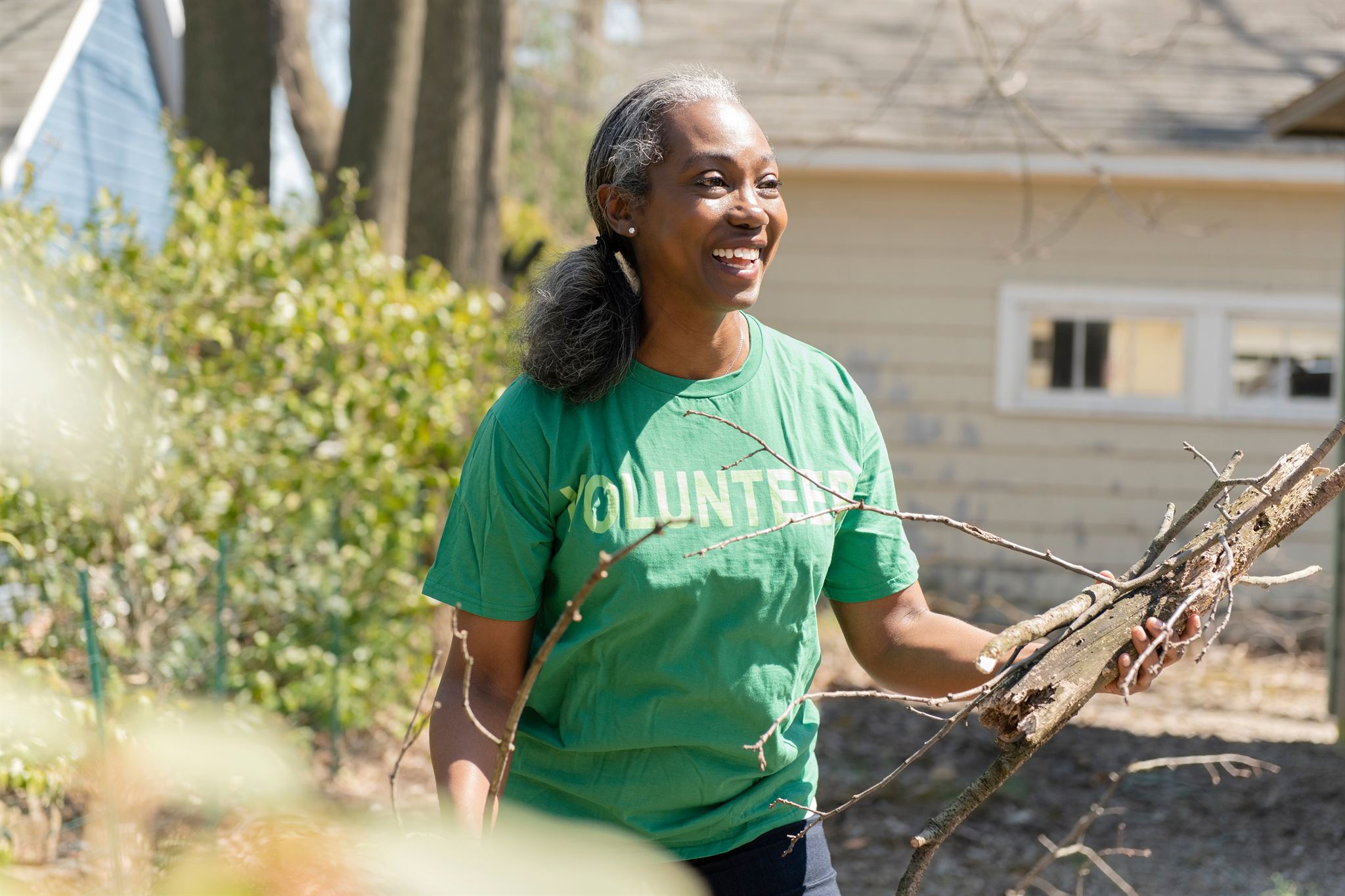 Volunteer-holding-branches